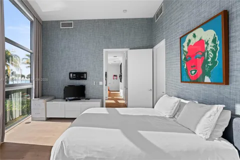 a bathroom with a shower sink and mirror