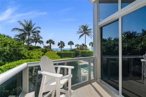a view of swimming pool with outdoor seating