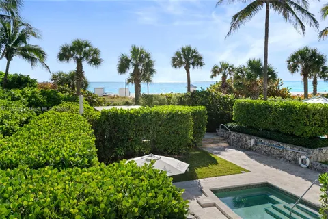 a view of a swimming pool with lounge chair