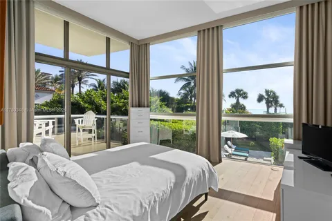 kids room with painting on the wall and a potted plant