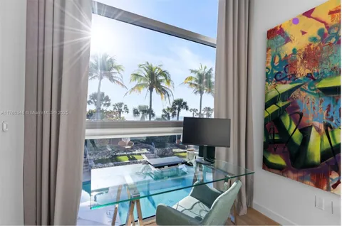 a kitchen with a stove and a window