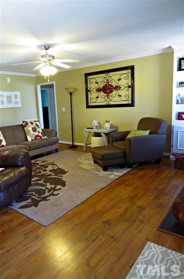 192 Williams Road Coats, NC 27521 - Photo 5 of 25 Spacious Family Room With Gas Log Fireplace. Newly Installed Hardwood Laminate Flooring.