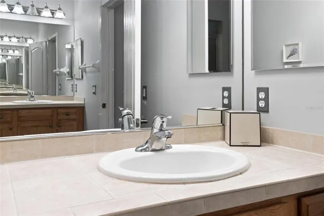 a bathroom with a sink and a mirror