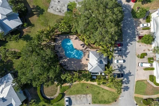 an aerial view of residential house with outdoor space and swimming pool