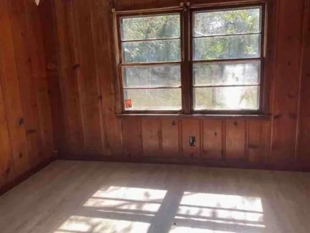 a kitchen with kitchen island granite countertop a sink stove and cabinets