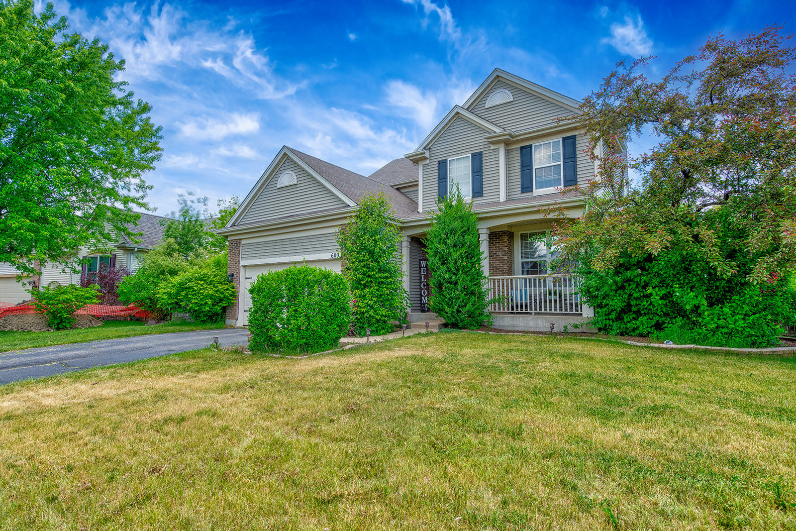 a front view of a house with a yard