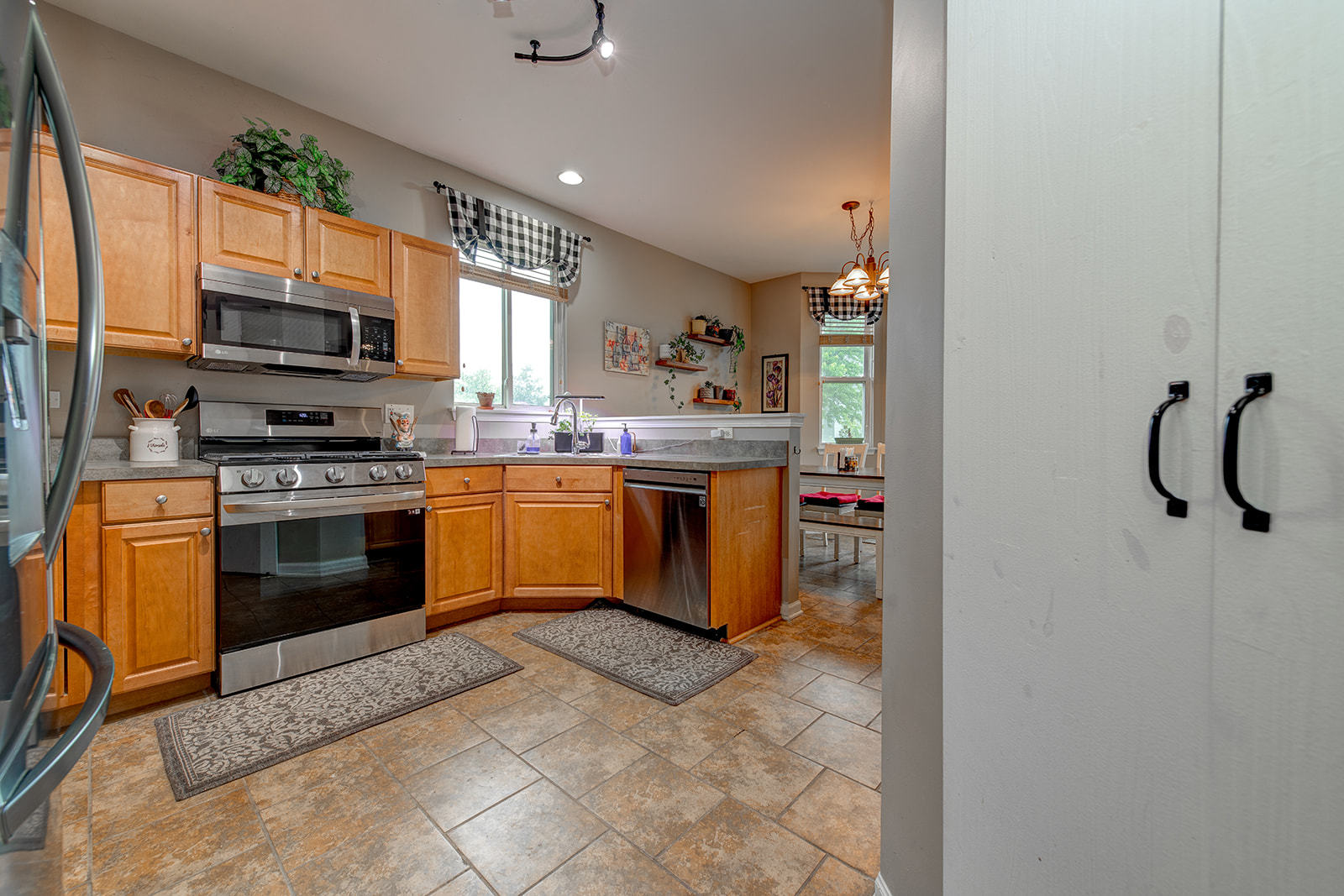 600 Cameron Drive Antioch, IL 60002 - Photo 8 of 23 a kitchen with stainless steel appliances granite countertop a stove a sink and a microwave