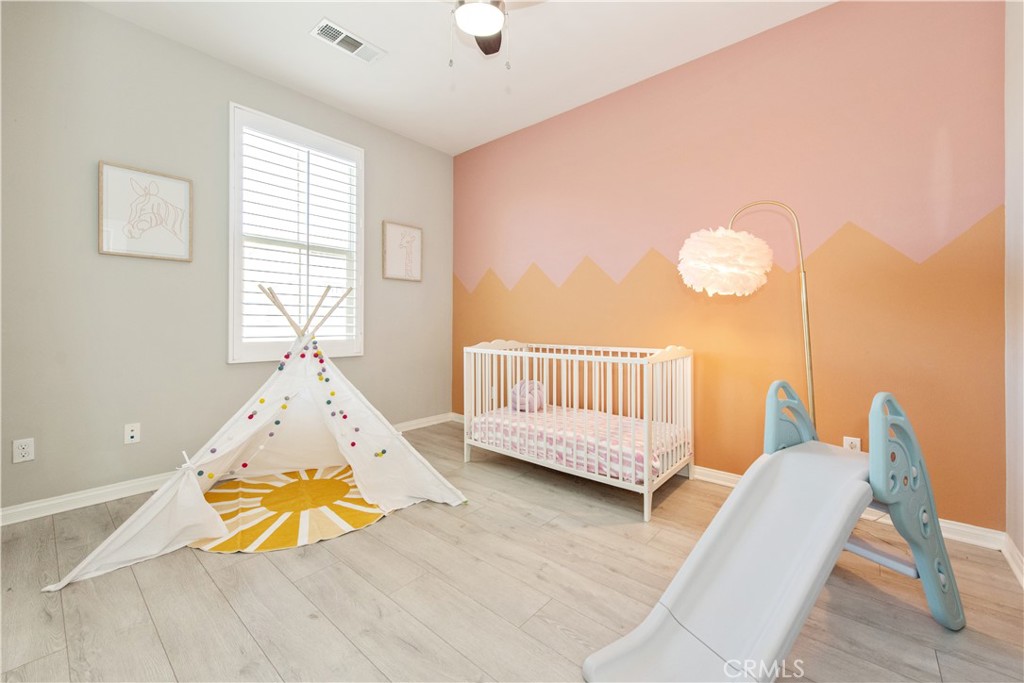 68 Origin Irvine, CA 92618 - Photo 38 of 43 a view of a bedroom with wooden floor and windows