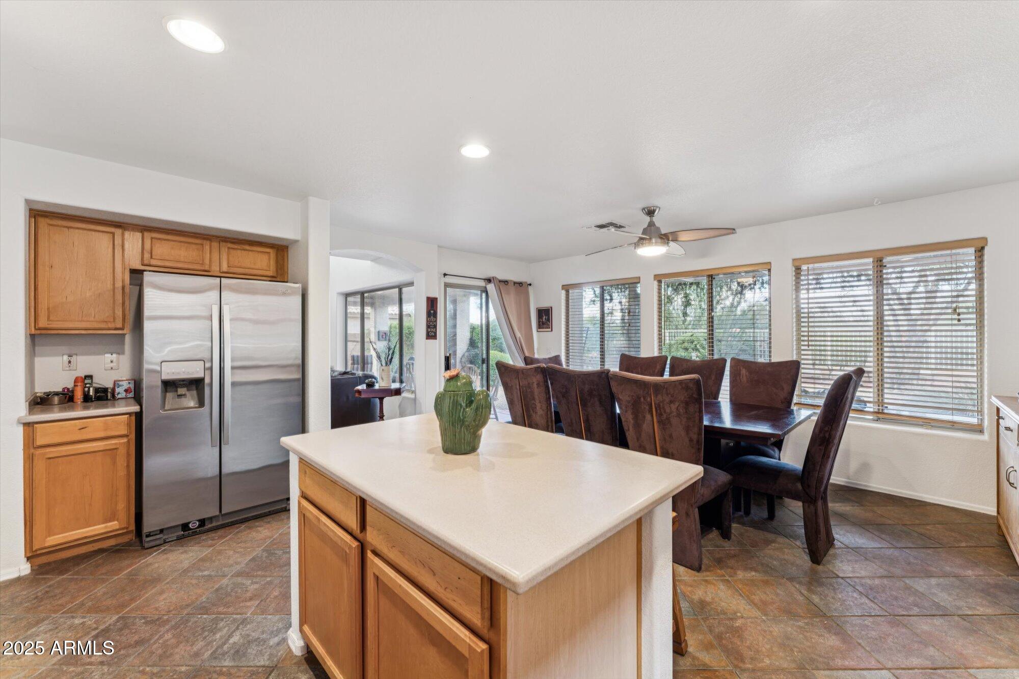 5128 East Via Dona Road Cave Creek, AZ 85331 - Photo 13 of 38 a view of a dining room with furniture and a potted plant