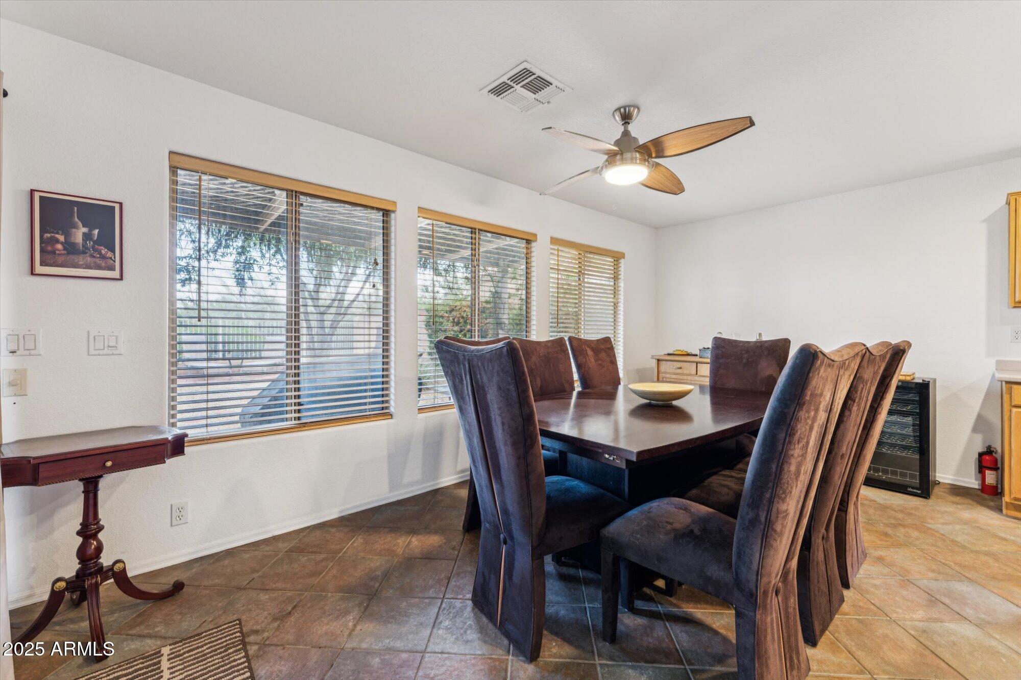 5128 East Via Dona Road Cave Creek, AZ 85331 - Photo 15 of 38 a view of a dining room with furniture window and outside view