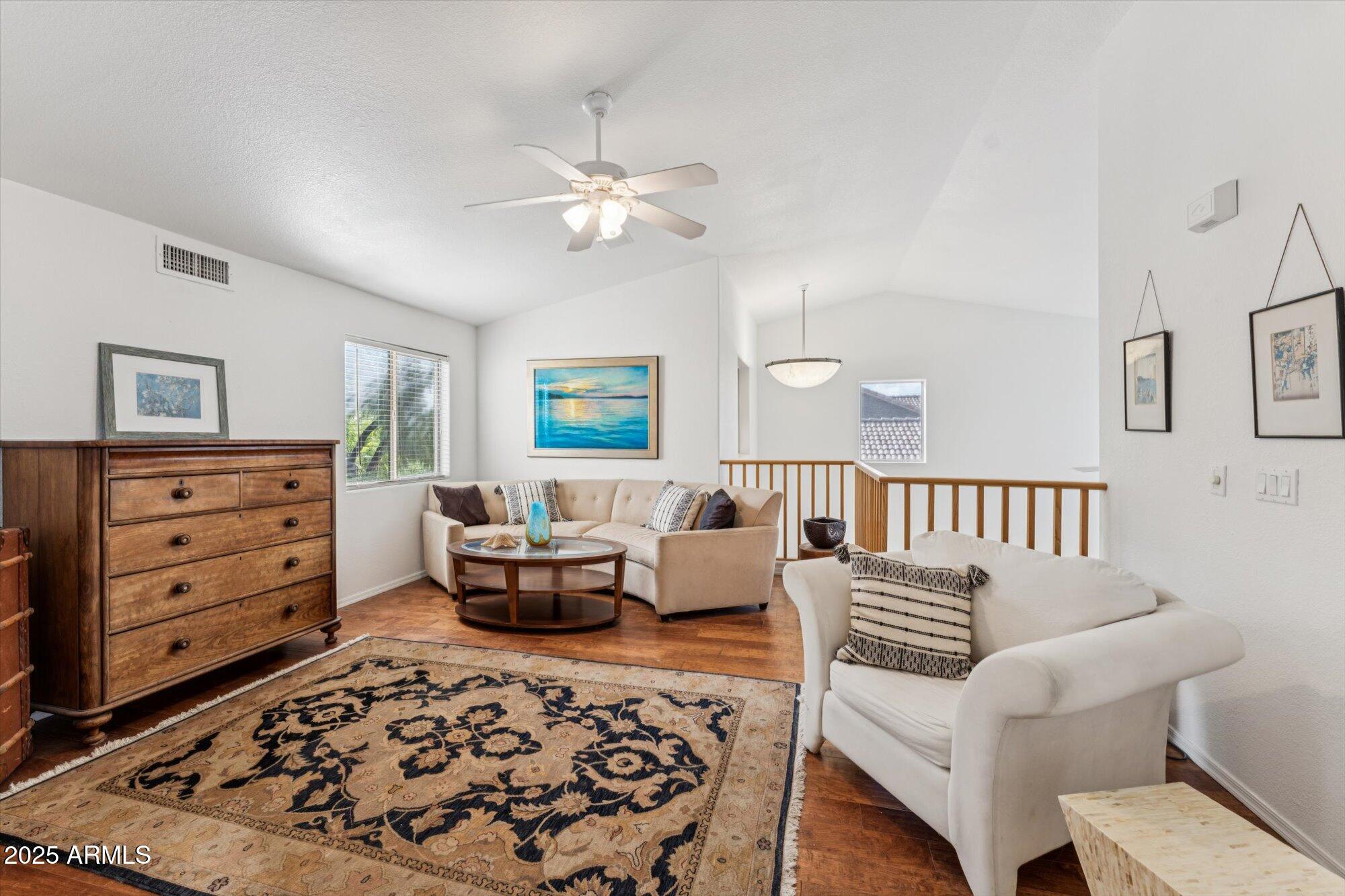 5128 East Via Dona Road Cave Creek, AZ 85331 - Photo 20 of 38 a living room with furniture and wooden floor