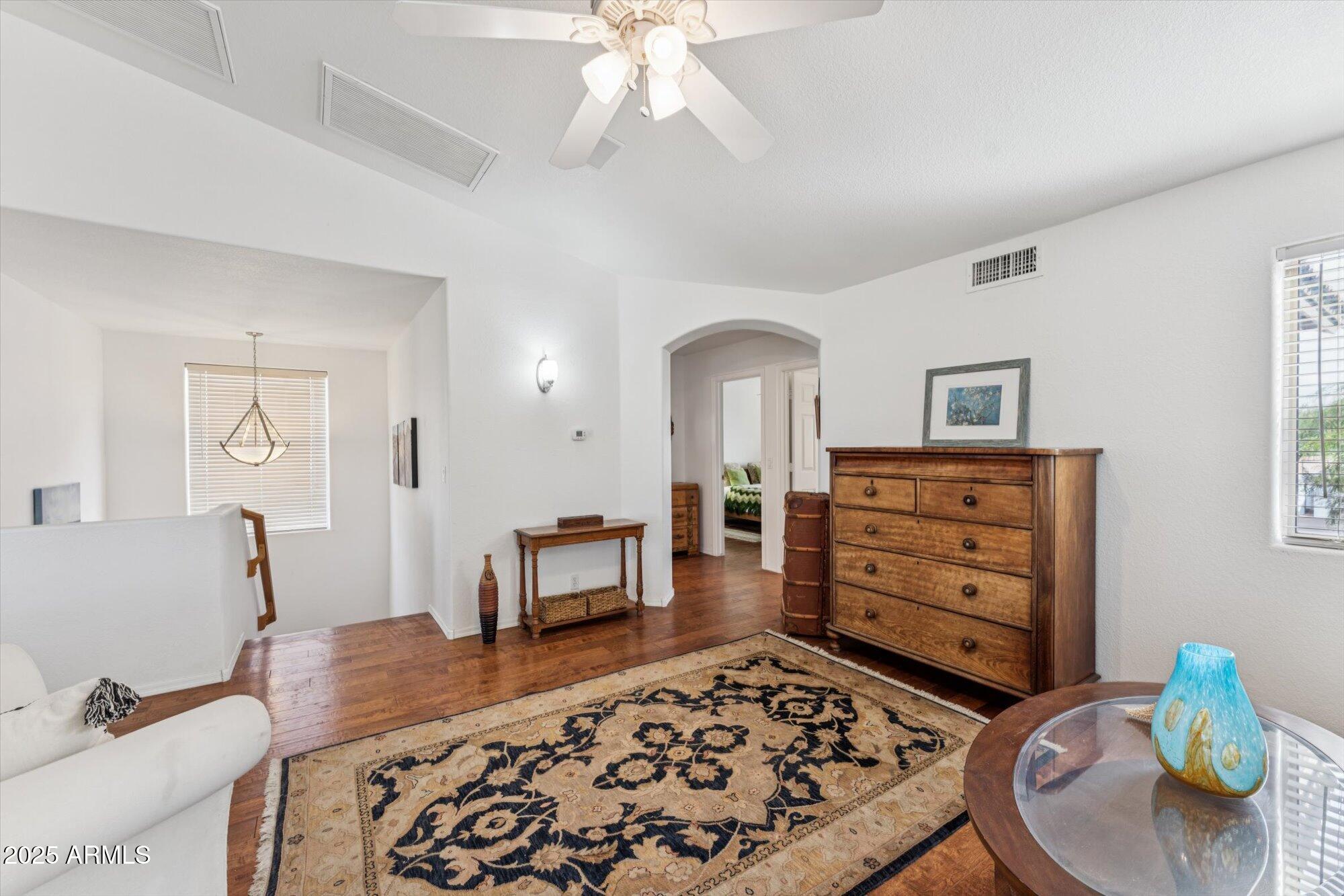 5128 East Via Dona Road Cave Creek, AZ 85331 - Photo 22 of 38 a living room with furniture and a wooden floor