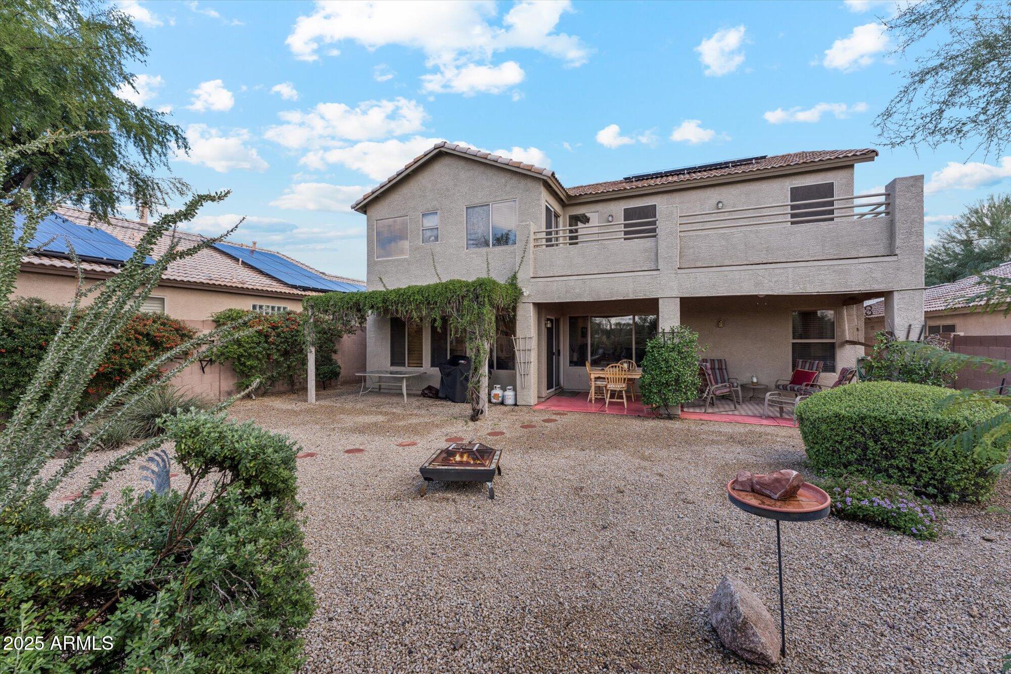 5128 East Via Dona Road Cave Creek, AZ 85331 - Photo 36 of 38 a view of a house with backyard and sitting area