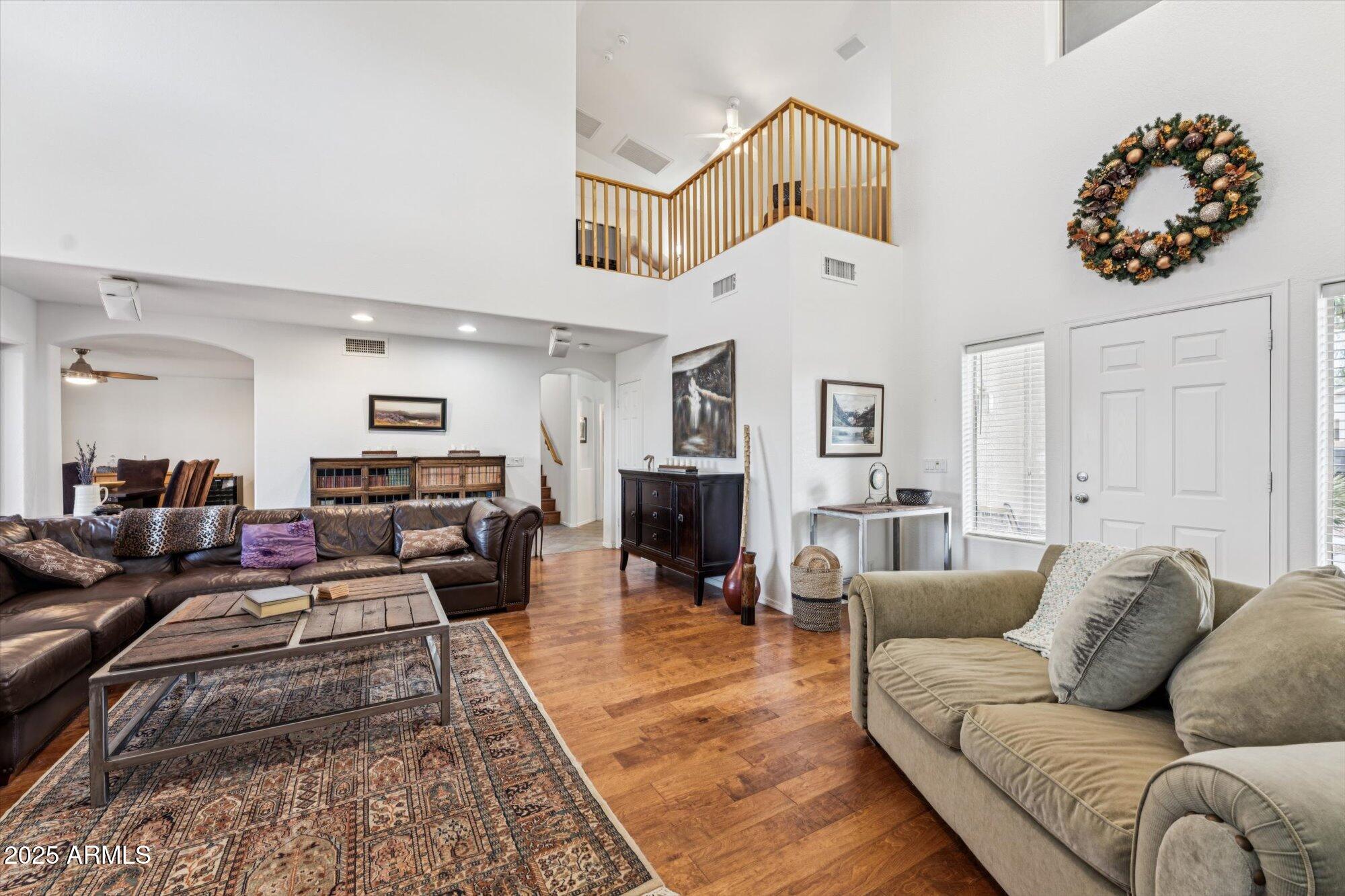5128 East Via Dona Road Cave Creek, AZ 85331 - Photo 4 of 38 a living room with furniture wooden floor and white walls