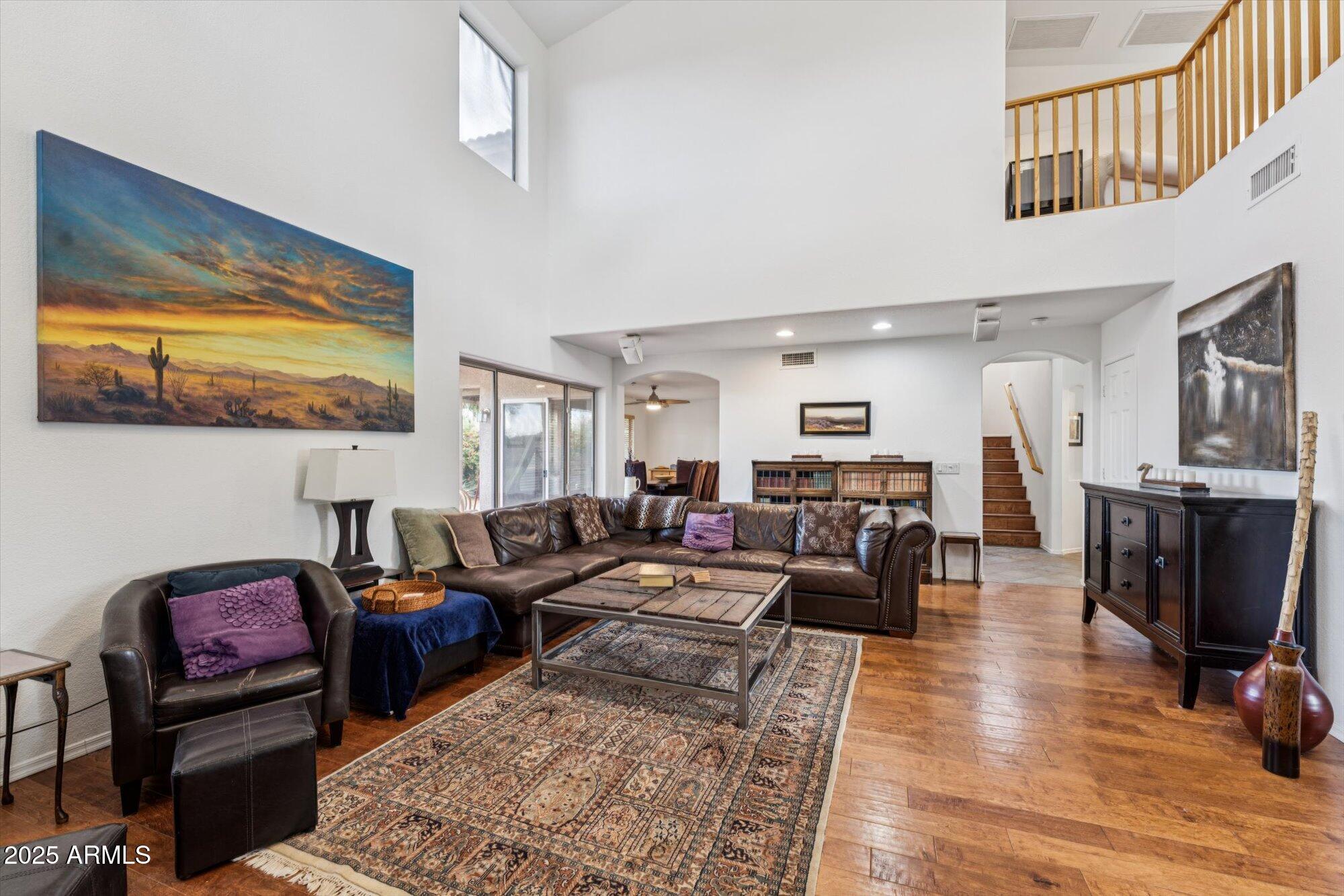 5128 East Via Dona Road Cave Creek, AZ 85331 - Photo 5 of 38 a living room with furniture and wooden floor
