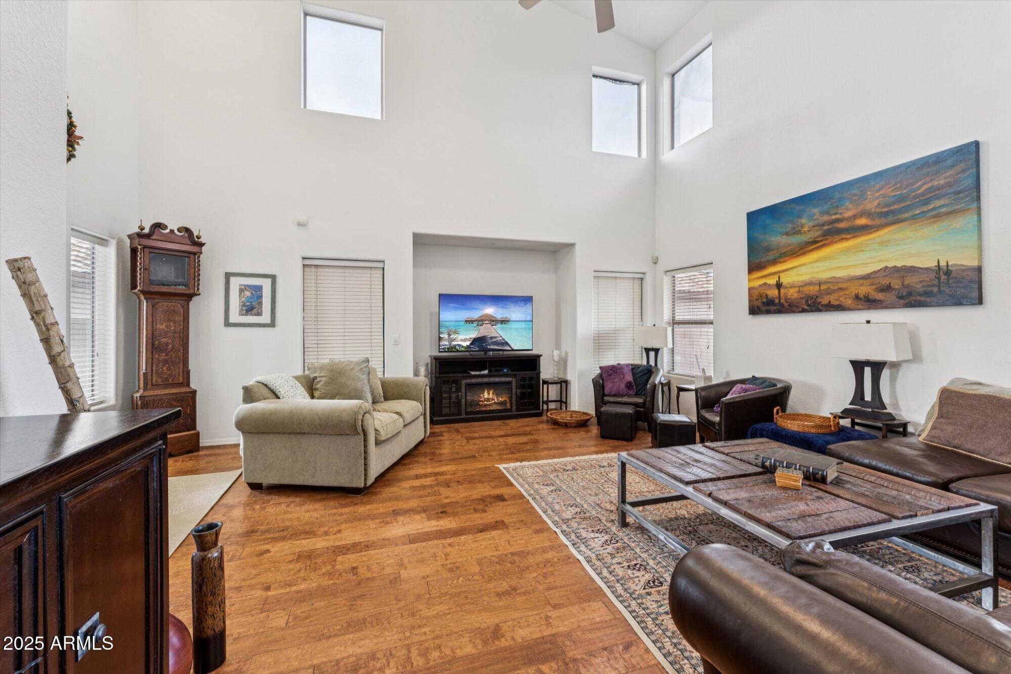 5128 East Via Dona Road Cave Creek, AZ 85331 - Photo 7 of 38 a living room with furniture and a flat screen tv