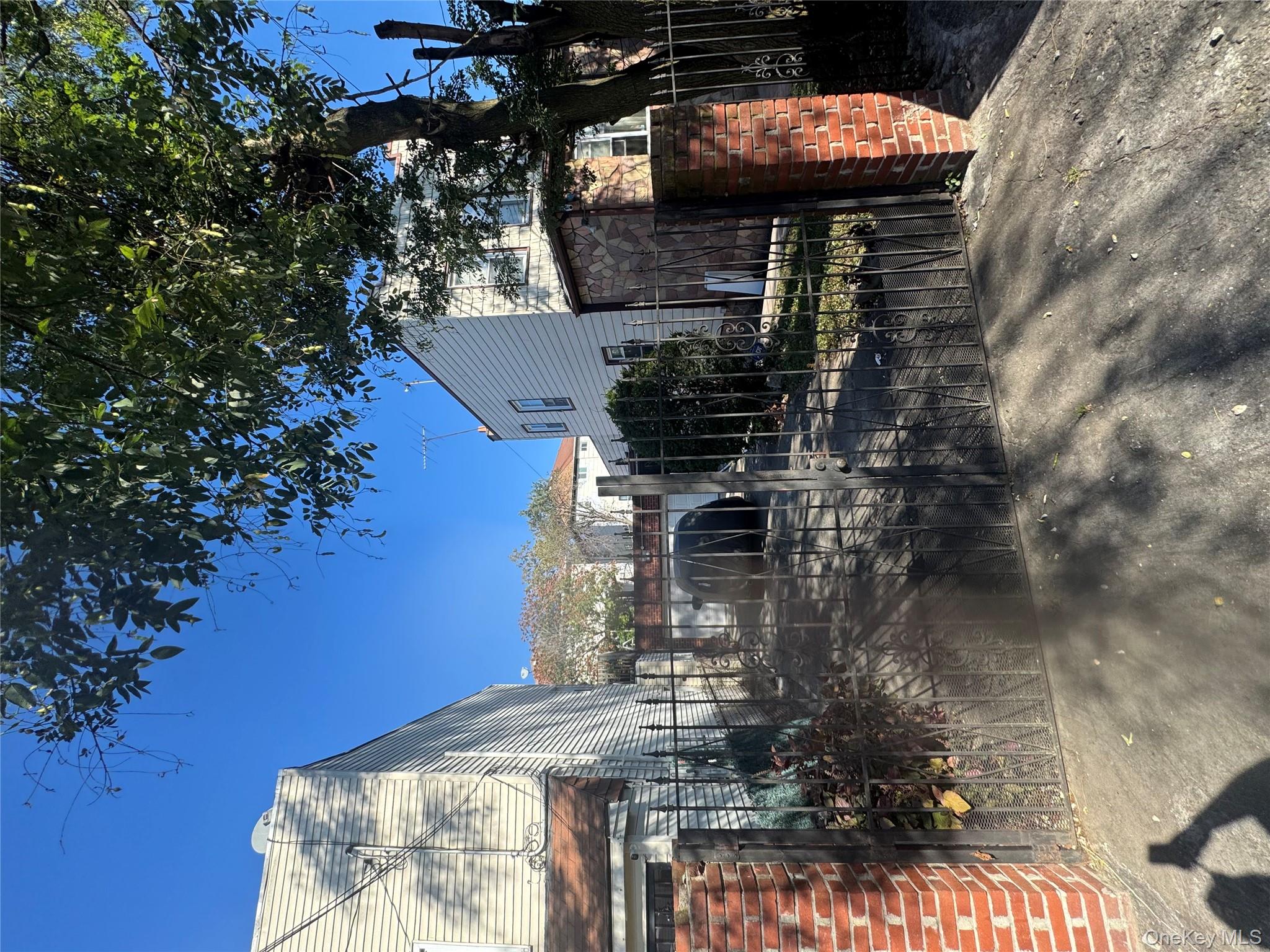 665 Varkens Hook Road Brooklyn, NY 11236 - Photo 3 of 3 a view of a house with patio