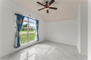 238 Rudder Road Gun Barrel City, TX 75156 - Photo 20 of 27 an empty room with windows and fan
