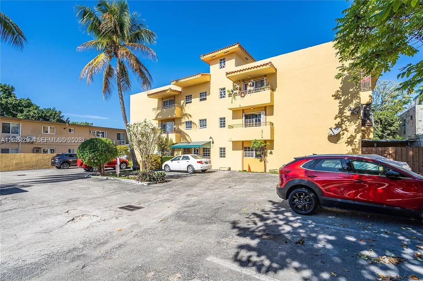 1351 Southwest 4th Street, Unit 8 Miami, FL 33135 - Photo 10 of 11 a front view of a house with parking space