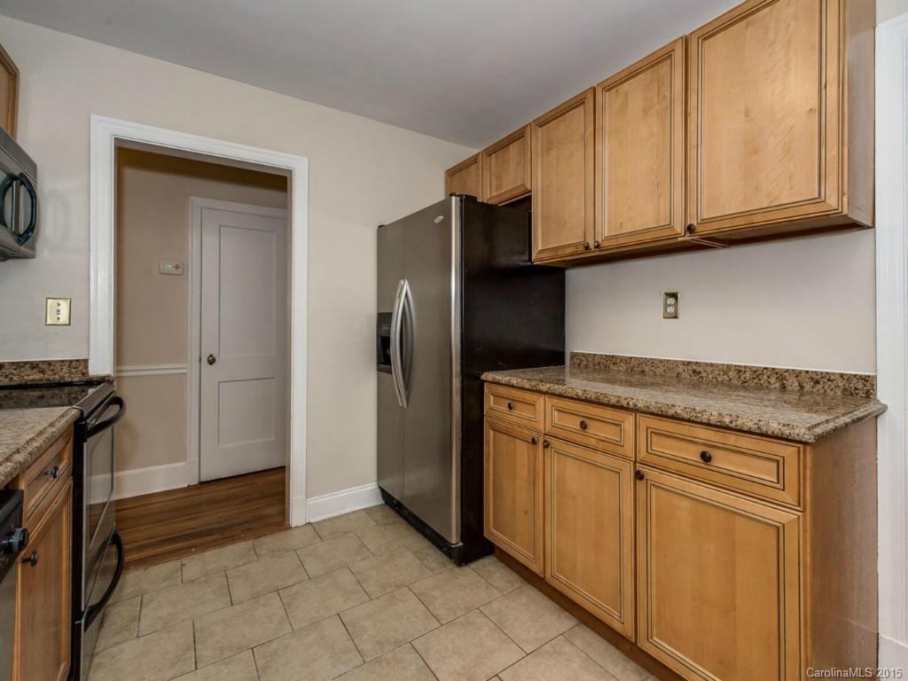 907 Sedgefield Road Charlotte, NC 28209 - Photo 11 of 21 a kitchen with stainless steel appliances granite countertop a refrigerator and a stove