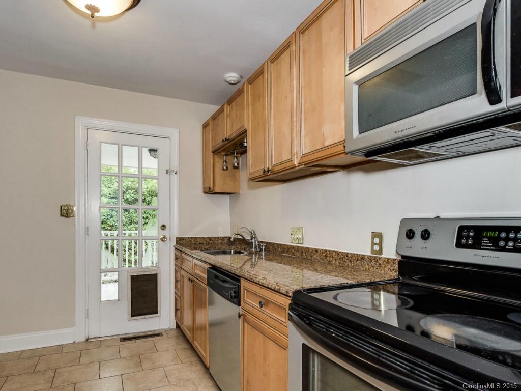 907 Sedgefield Road Charlotte, NC 28209 - Photo 12 of 21 a kitchen with a stove and a microwave