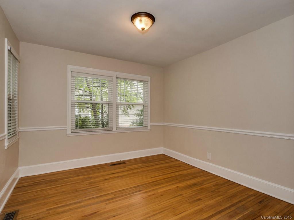 907 Sedgefield Road Charlotte, NC 28209 - Photo 17 of 21 wooden floor in an empty room with a window