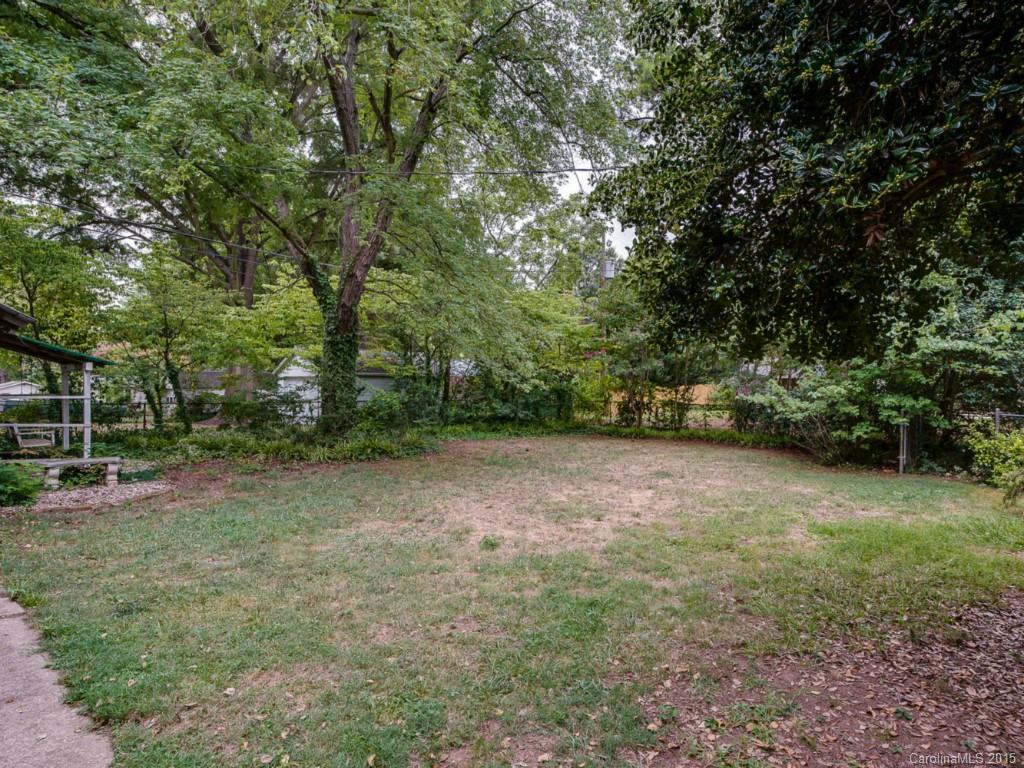 907 Sedgefield Road Charlotte, NC 28209 - Photo 20 of 21 a view of a field with trees in front of it