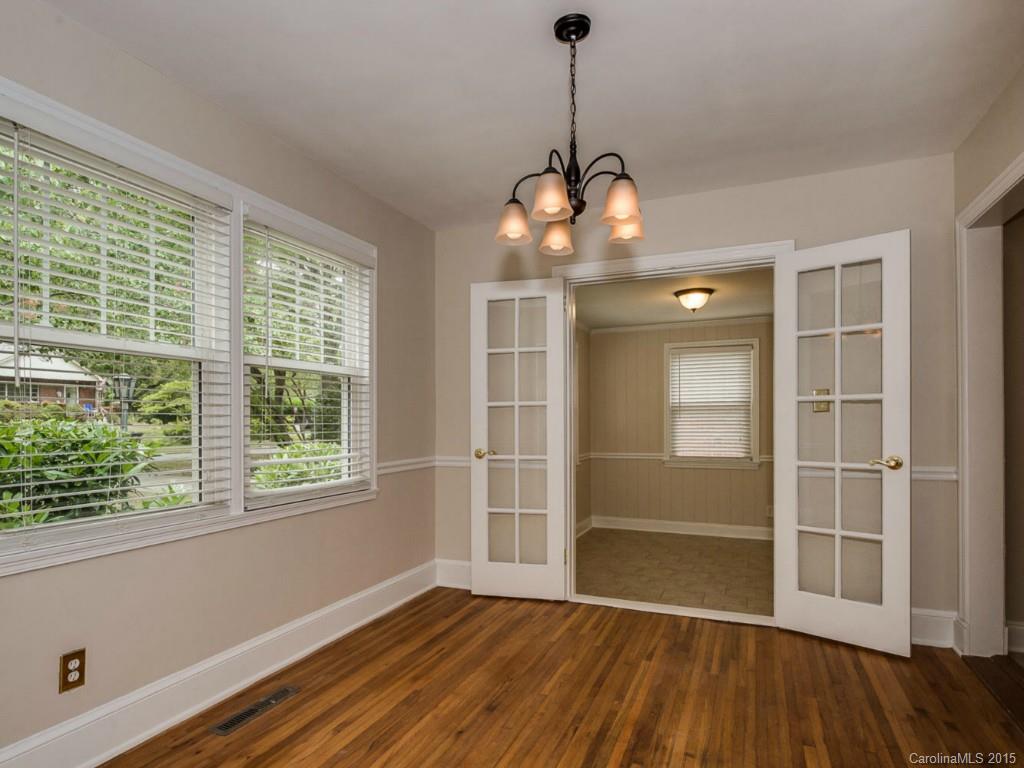907 Sedgefield Road Charlotte, NC 28209 - Photo 6 of 21 a view of wooden floor and a chandelier in a room