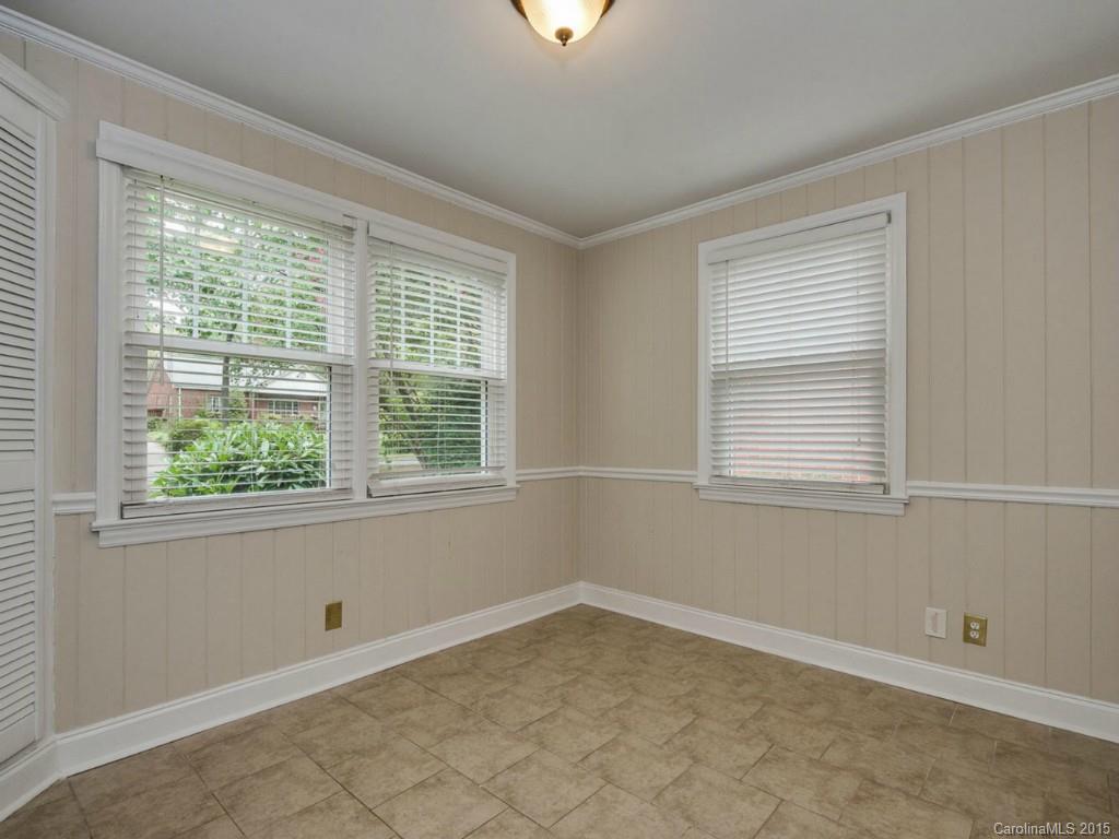 907 Sedgefield Road Charlotte, NC 28209 - Photo 8 of 21 a view of an empty room with a window