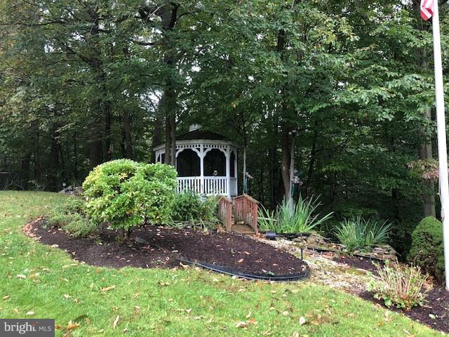 1217 Brookview Road Baltimore, MD 21286 - Photo 15 of 16 a front view of a house with a yard