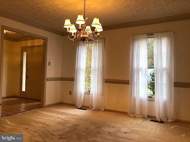 1217 Brookview Road Baltimore, MD 21286 - Photo 4 of 16 a view of a chandelier in a livingroom with window