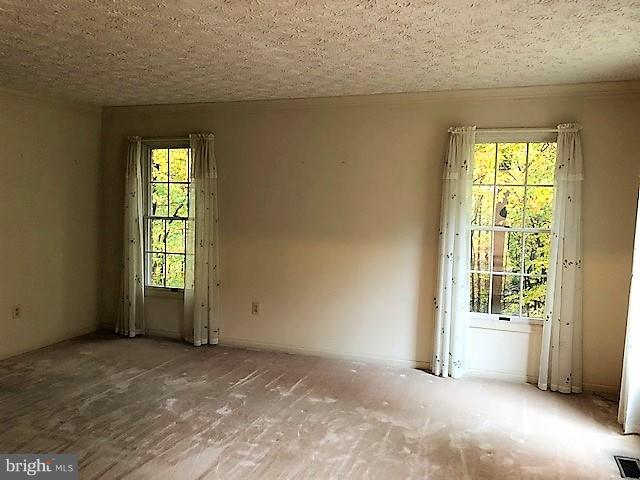 1217 Brookview Road Baltimore, MD 21286 - Photo 5 of 16 a view of an empty room with a window