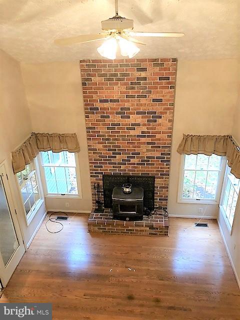1217 Brookview Road Baltimore, MD 21286 - Photo 6 of 16 a living room with fireplace furniture and a fireplace