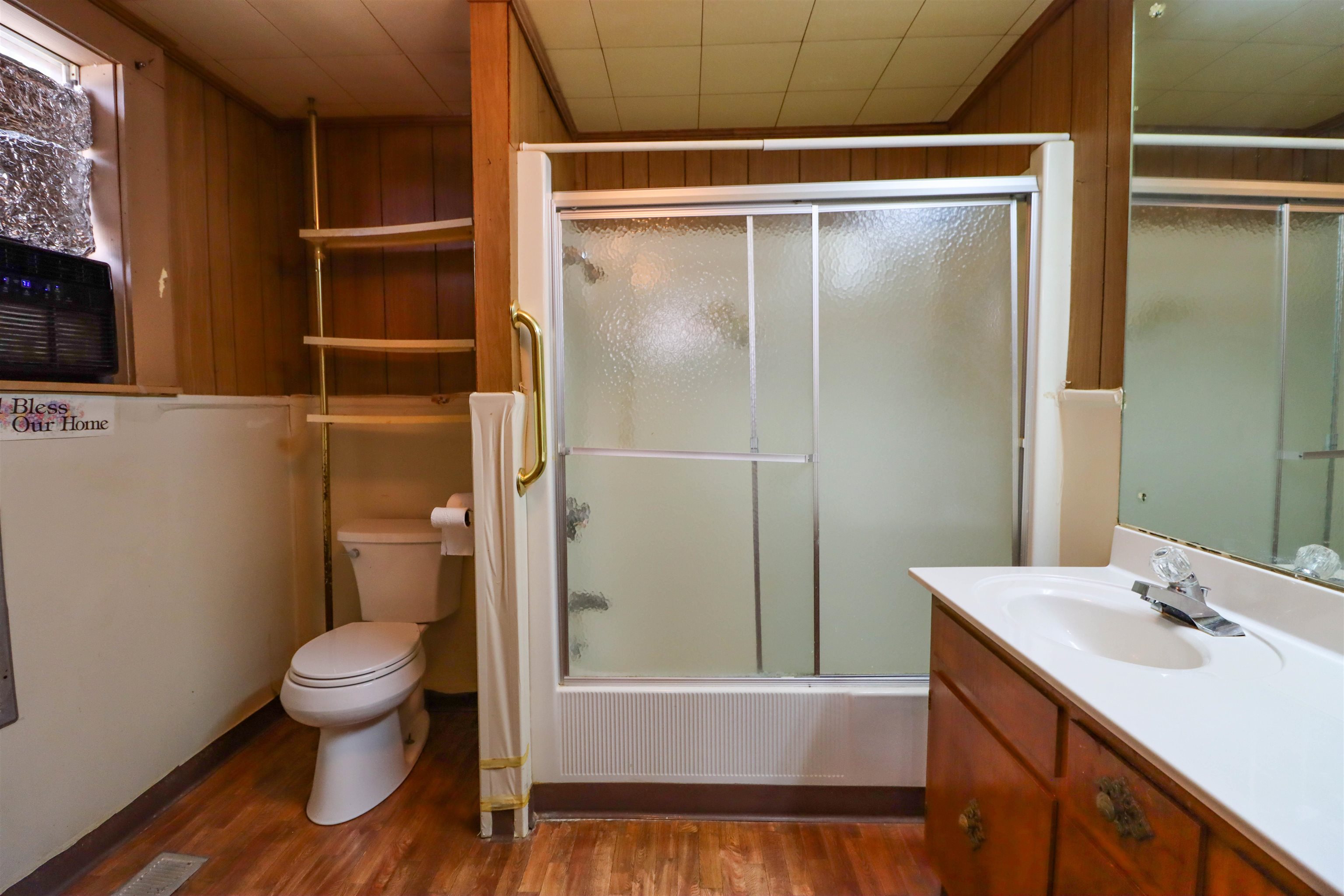 2250 Chisholm Lake Road Ripley, TN 38063 - Photo 14 of 32 a bathroom with a sink a toilet and shower