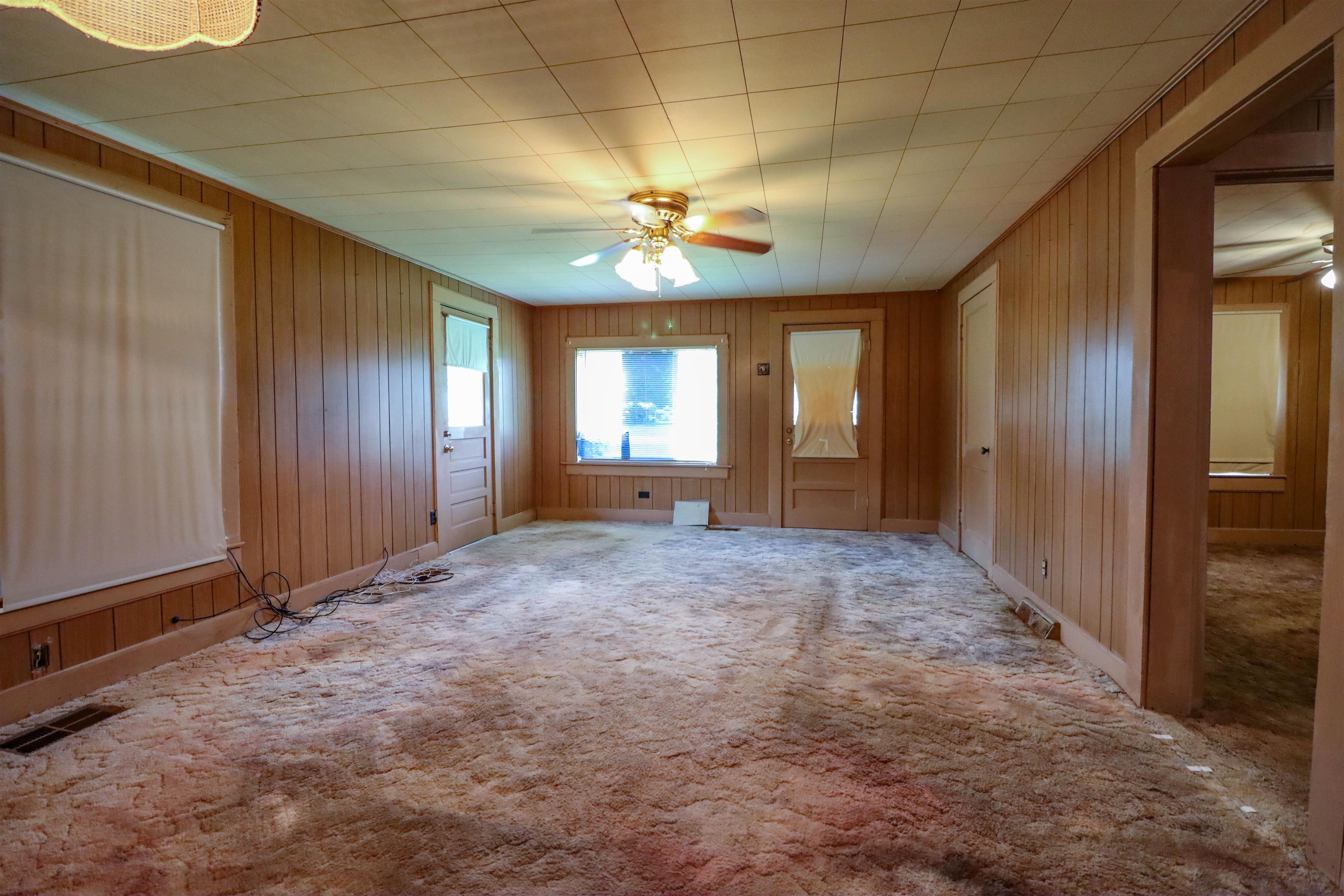 2250 Chisholm Lake Road Ripley, TN 38063 - Photo 16 of 32 an empty room with windows and fan
