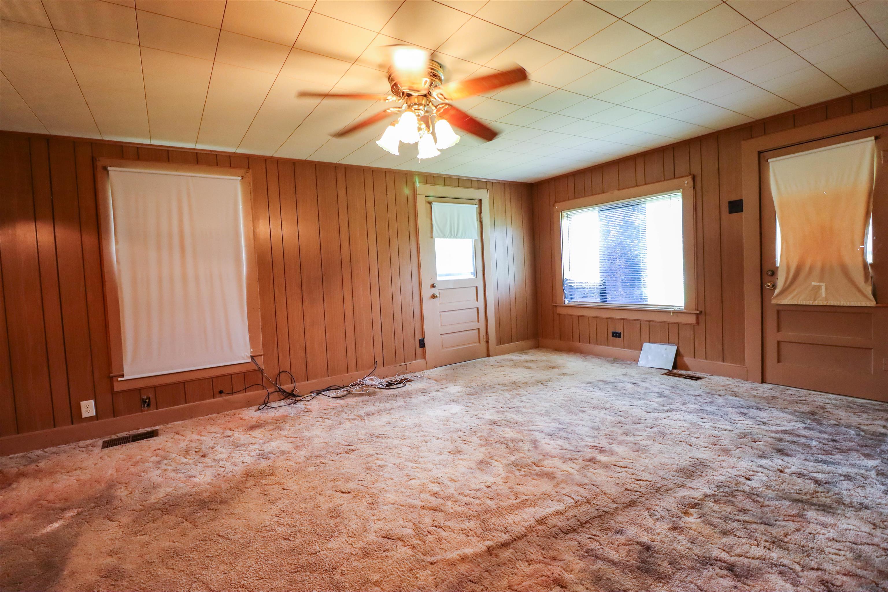 2250 Chisholm Lake Road Ripley, TN 38063 - Photo 17 of 32 an empty room with windows and fan
