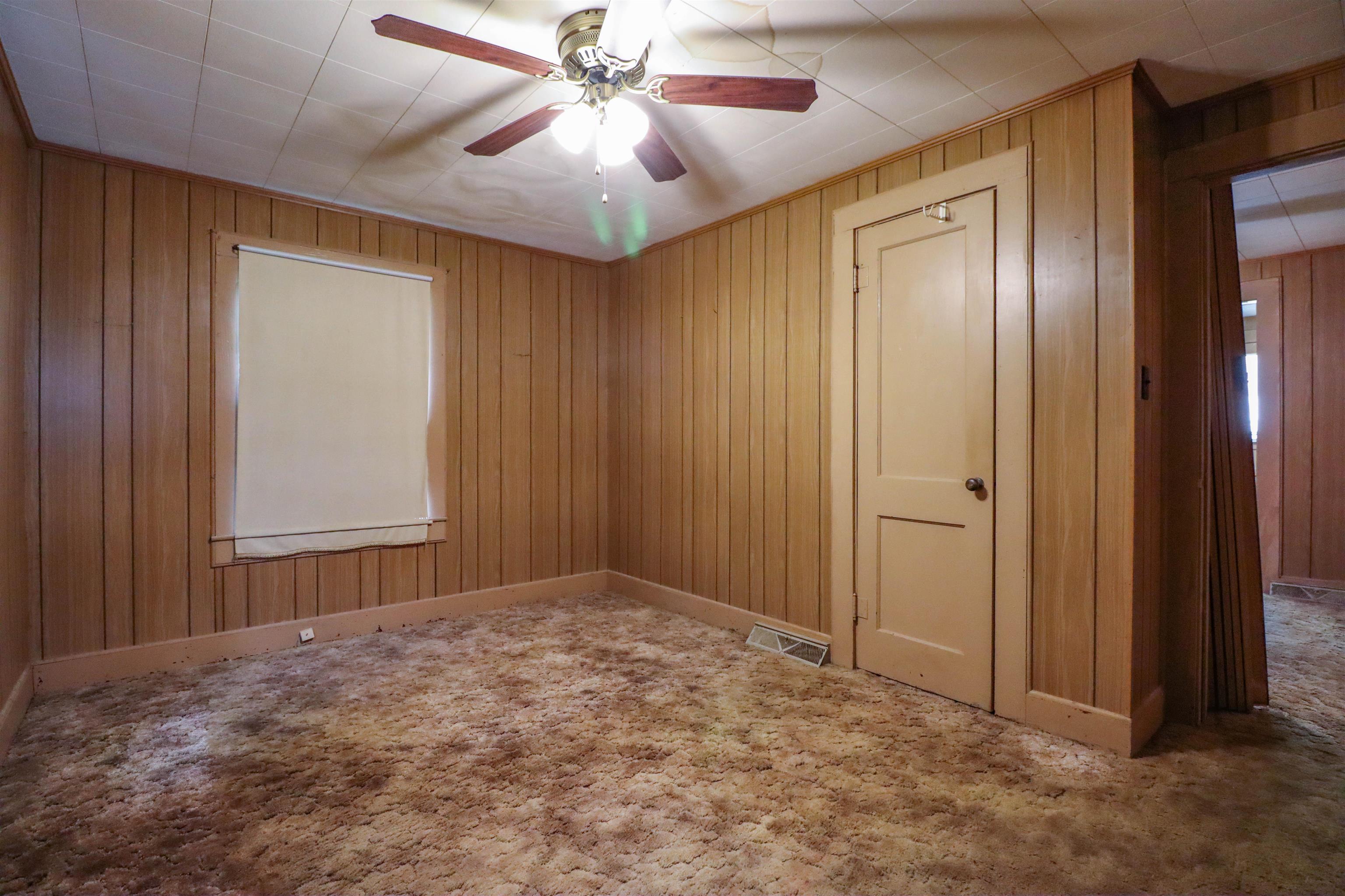2250 Chisholm Lake Road Ripley, TN 38063 - Photo 20 of 32 an empty room with closet and a chandelier fan