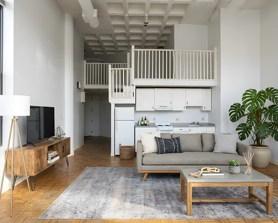 a living room with furniture a flat screen tv and a rug