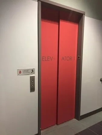 a view of a hallway with windows