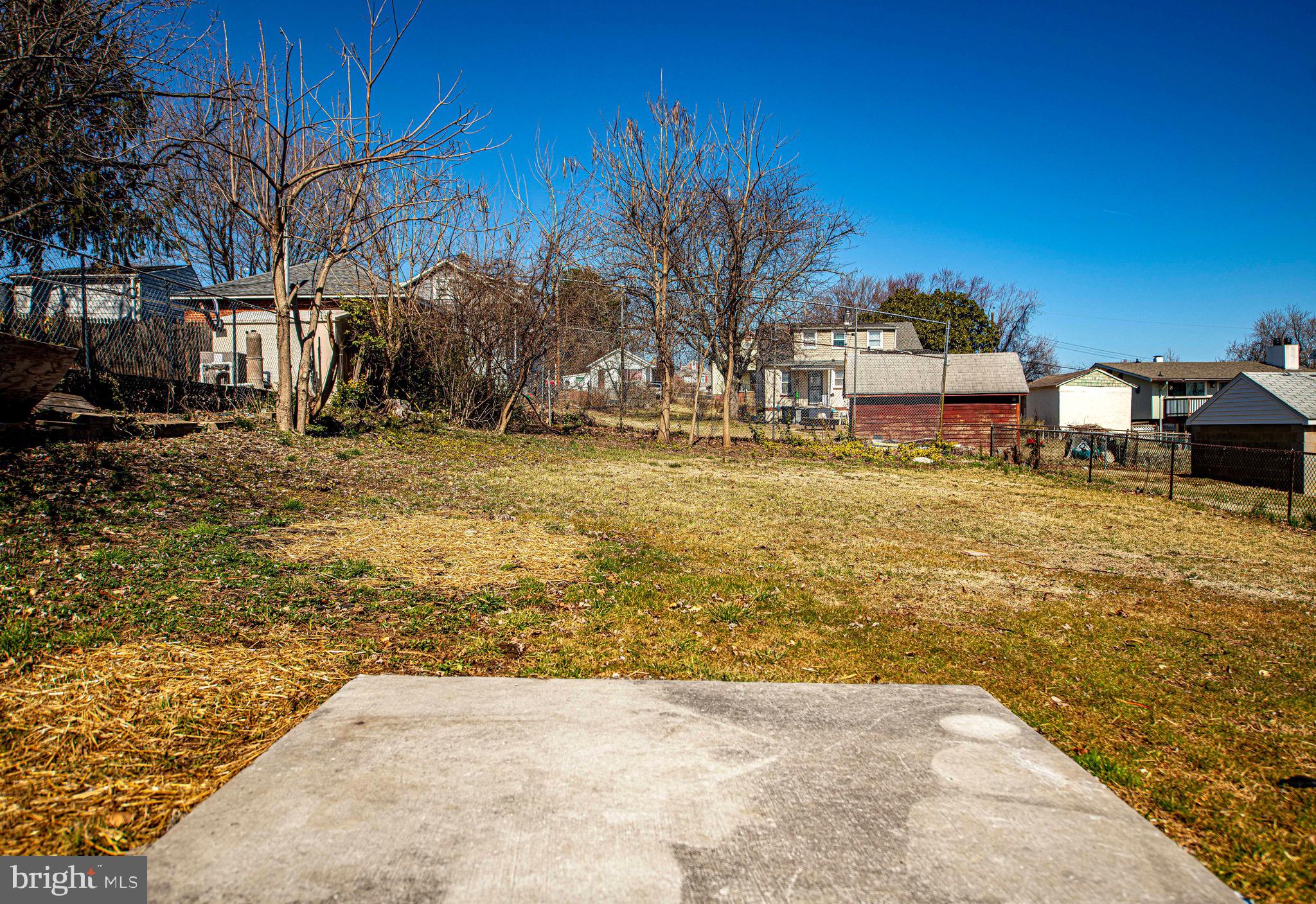 7906 31st Street Rosedale, MD 21237 - Photo 8 of 33 a view of a yard with a large tree