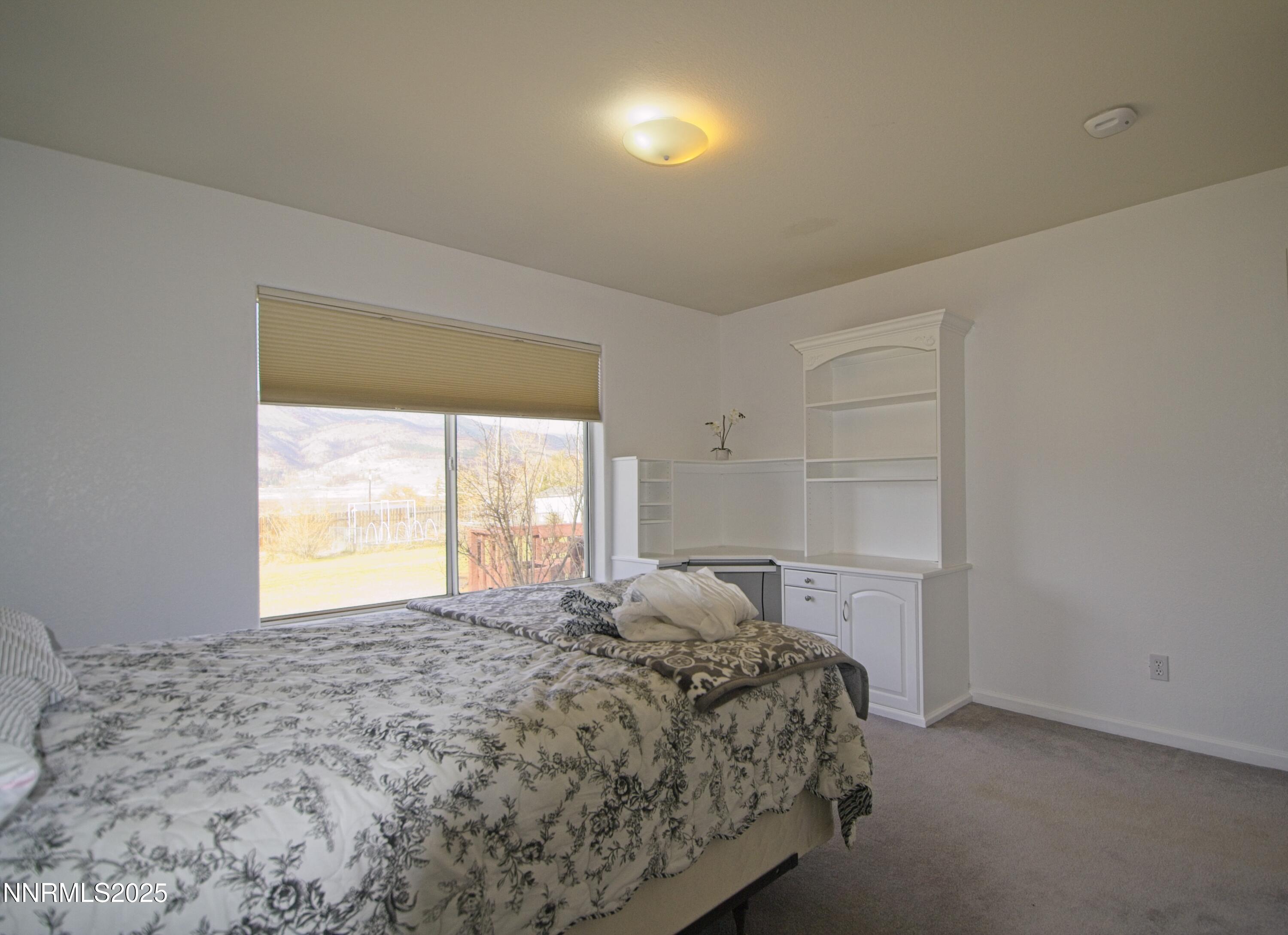 1905 Lakeshore Drive Washoe Valley, NV 89704 - Photo 12 of 31 a bedroom with a bed and a window