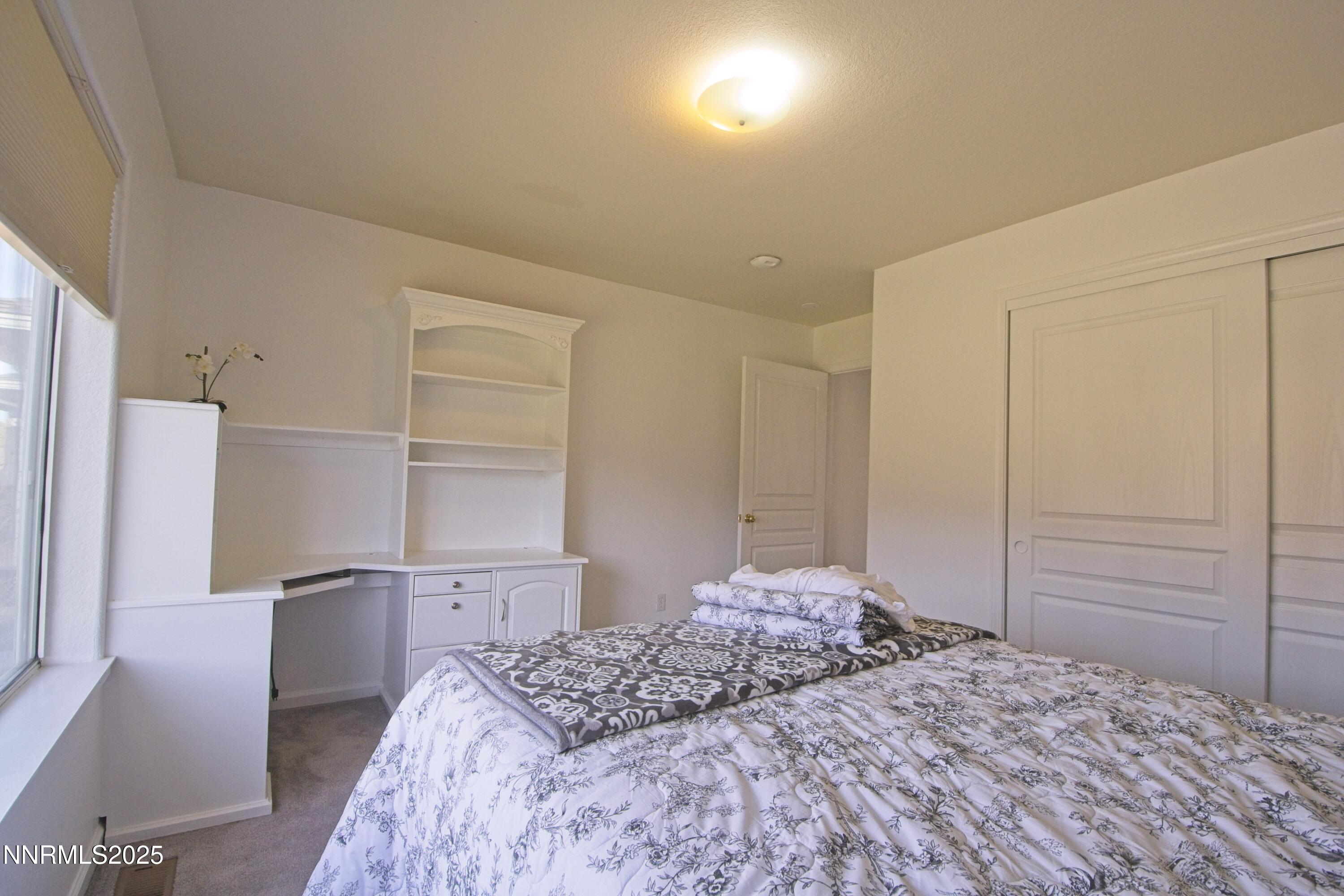 1905 Lakeshore Drive Washoe Valley, NV 89704 - Photo 13 of 31 a bedroom with a bed and a cabinets