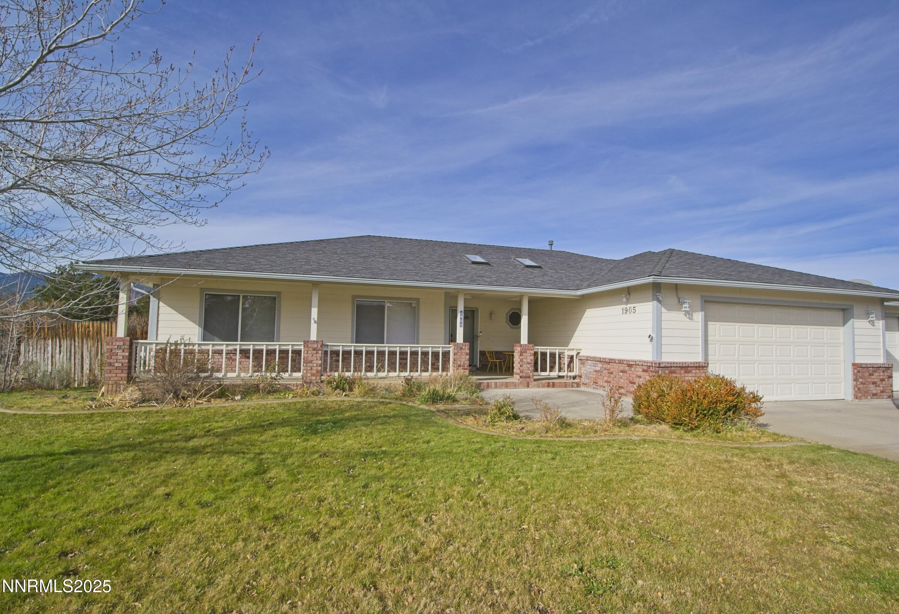 1905 Lakeshore Drive Washoe Valley, NV 89704 - Photo 2 of 31 a front view of a house with garden