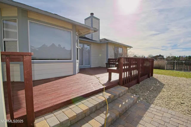 a view of a backyard with sitting area