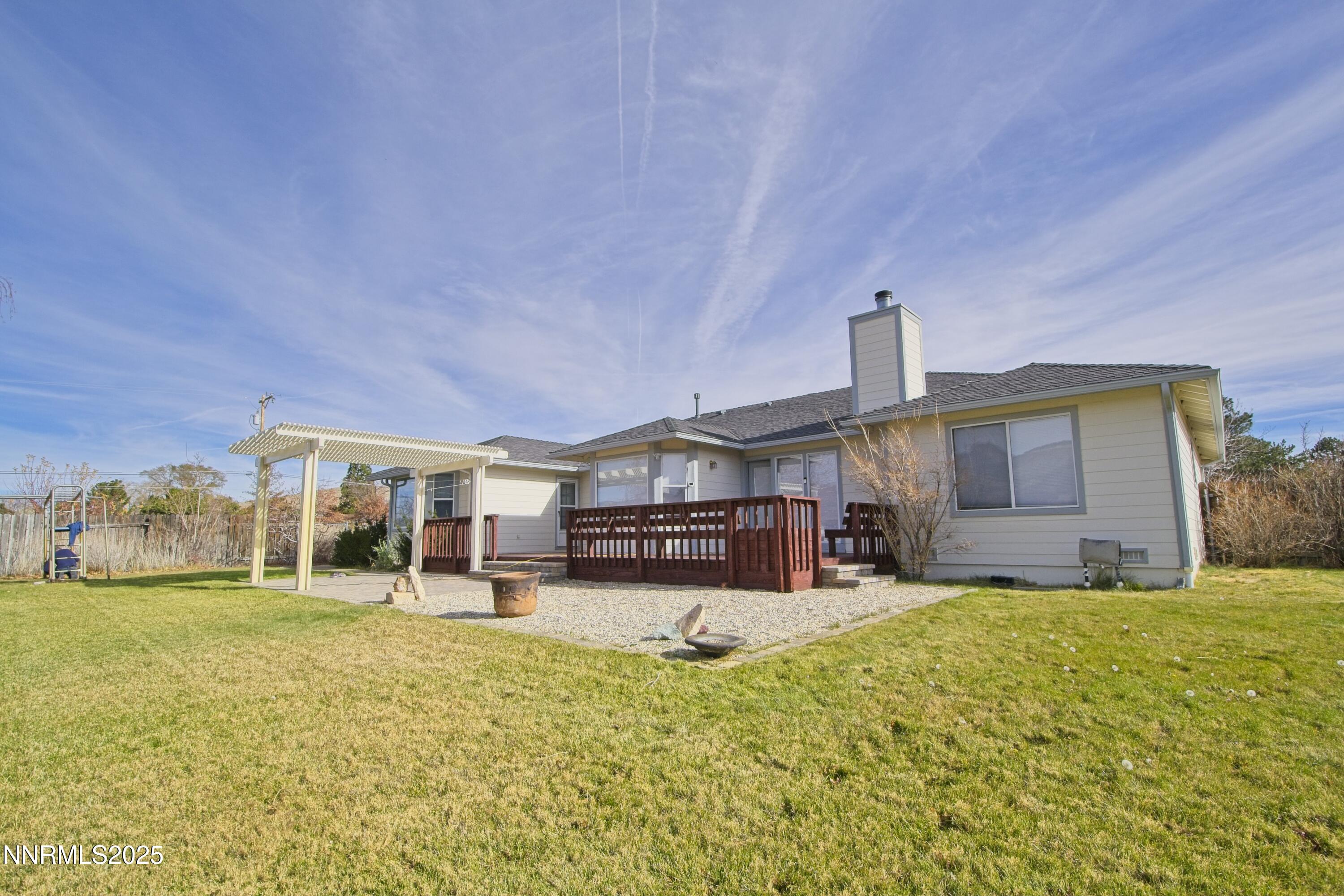 1905 Lakeshore Drive Washoe Valley, NV 89704 - Photo 24 of 31 a view of a house with a big yard and large tree
