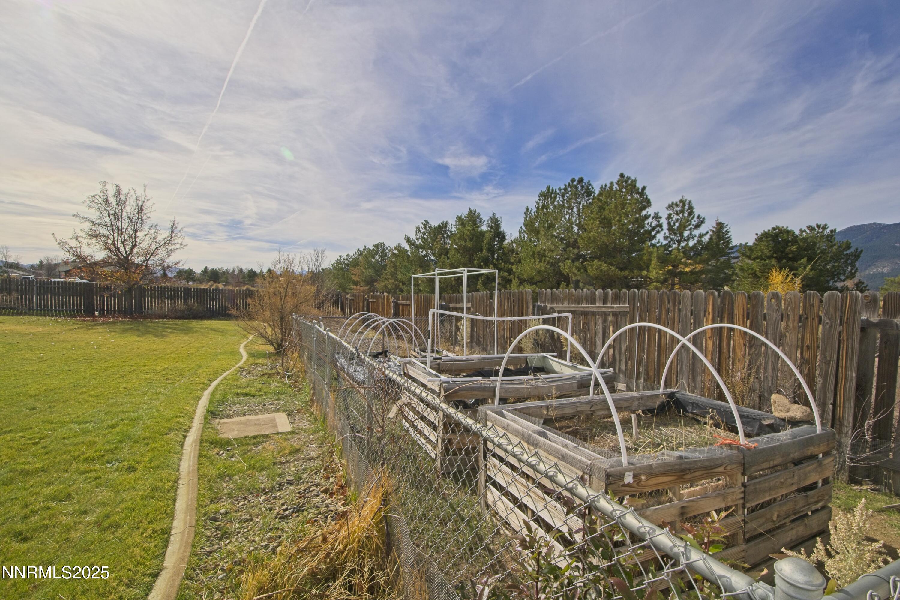 1905 Lakeshore Drive Washoe Valley, NV 89704 - Photo 25 of 31 a view of a swimming pool with a table and chairs next to a yard