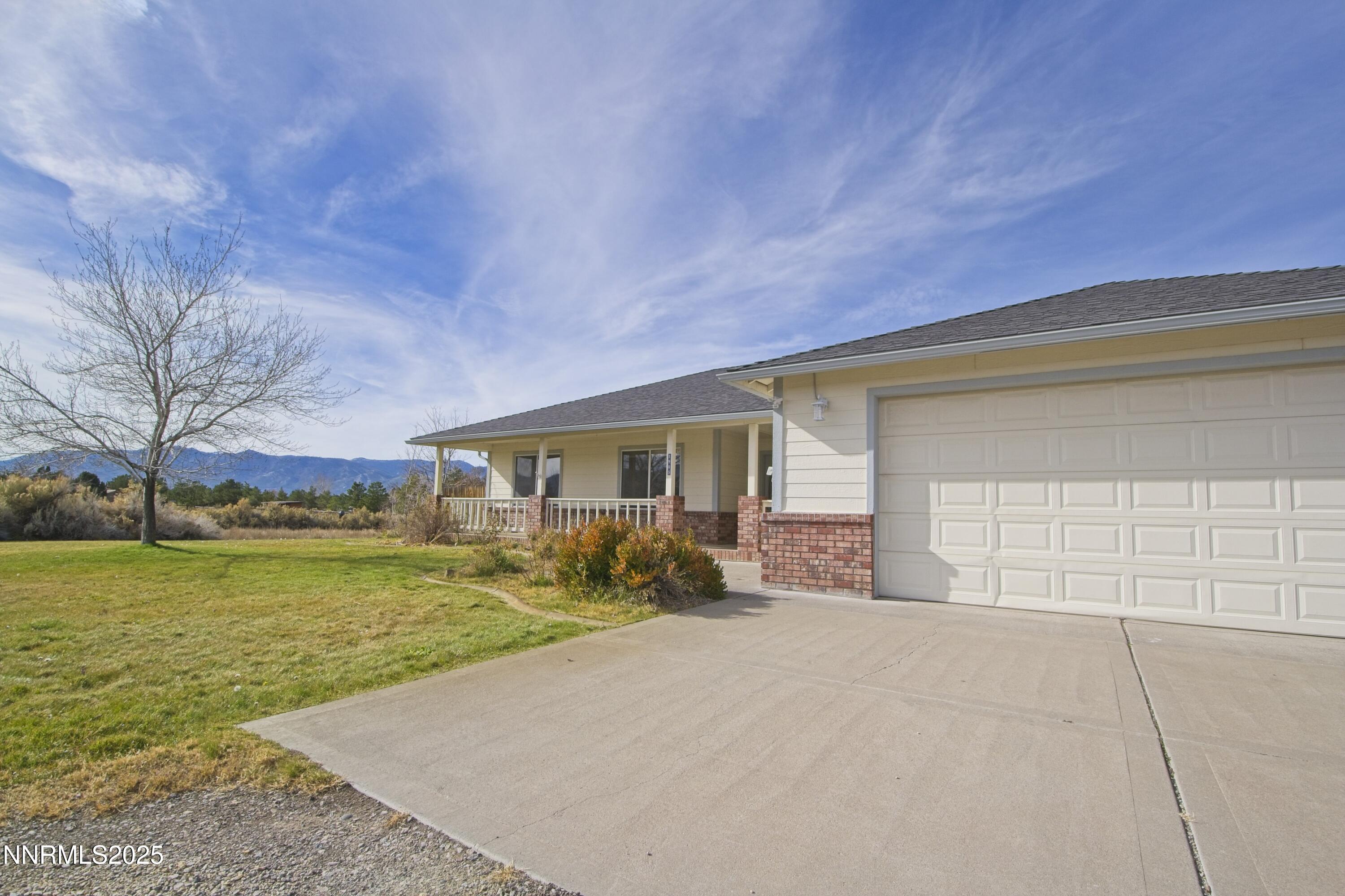 1905 Lakeshore Drive Washoe Valley, NV 89704 - Photo 31 of 31 a view of a house with backyard and trees