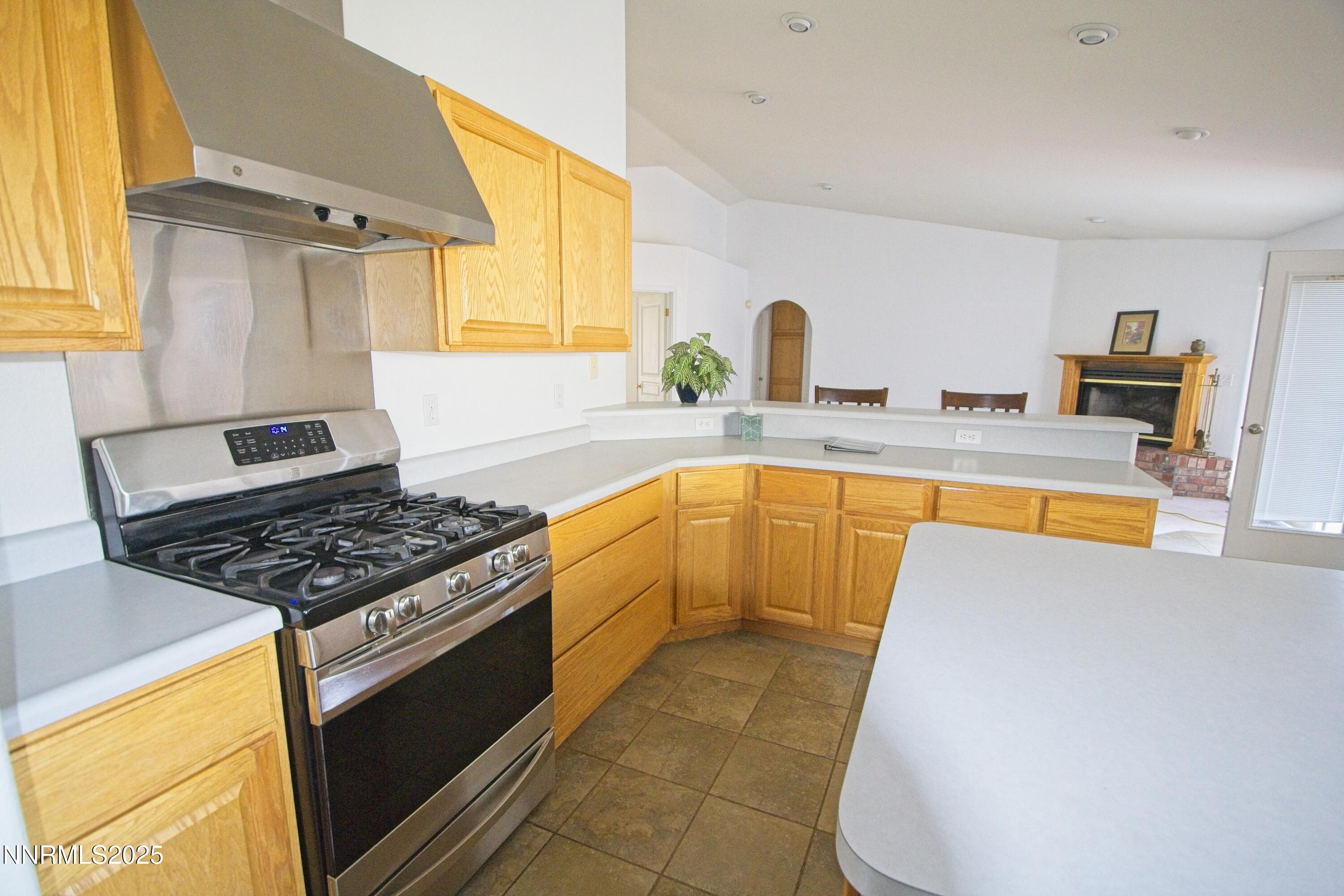 1905 Lakeshore Drive Washoe Valley, NV 89704 - Photo 4 of 31 a kitchen with granite countertop a stove and a sink
