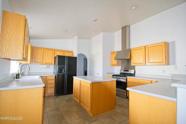 a large kitchen with stainless steel appliances