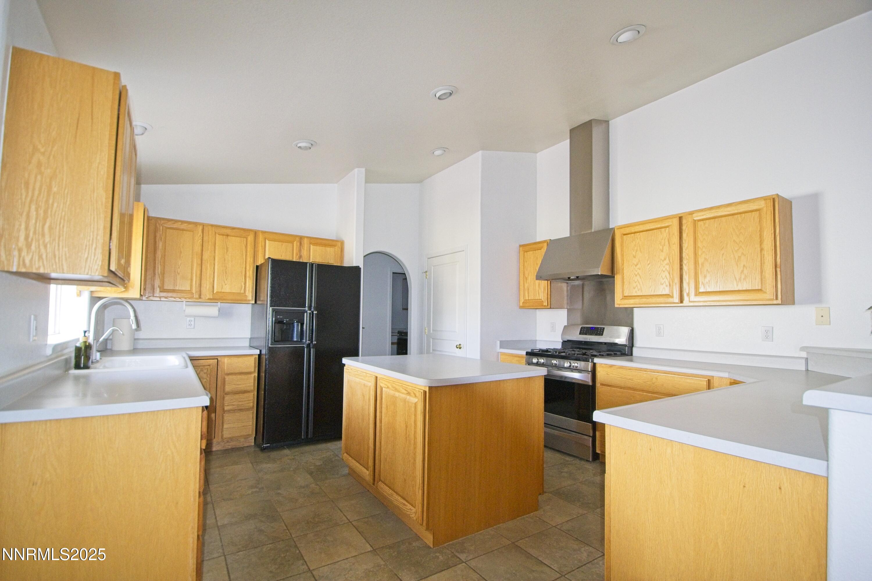 1905 Lakeshore Drive Washoe Valley, NV 89704 - Photo 5 of 31 a large kitchen with stainless steel appliances